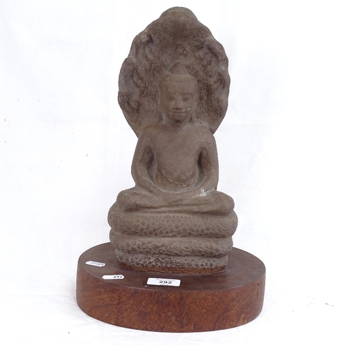 292 - A large moulded stone seated Buddha on wood plinth, overall height 37cm