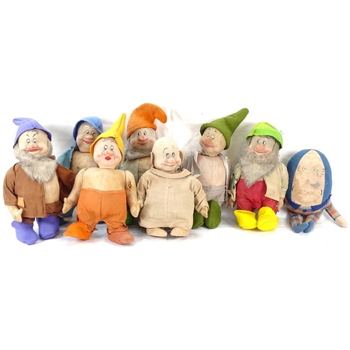 324 - A group of Vintage straw-filled Snow White and the Seven Dwarfs dolls, and a Humpty Dumpty doll