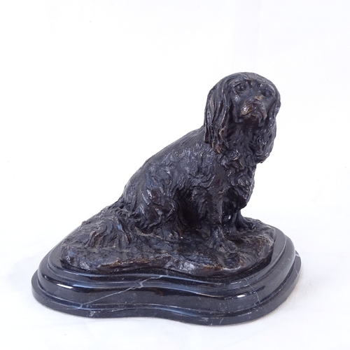 61 - After Mene, a bronzed spelter seated dog sculpture, on stepped veined black marble plinth, signed, o... 