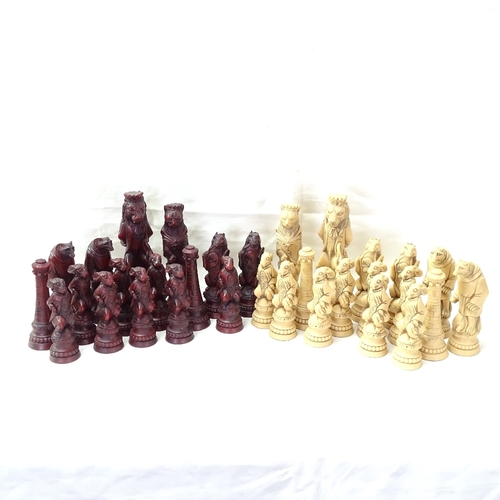 113 - A set of cream and red stained resin chess pieces, King height 19.5cm