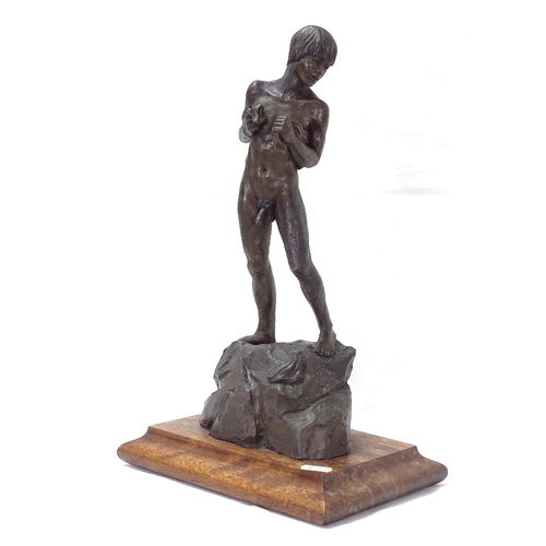 90 - Neil Godfrey, patinated spelter nude man on rocks, signed and dated 1992, overall height 42cm