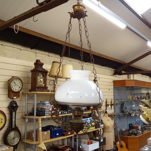 357 - A large cast-brass and milk glass hanging light fitting, with chimney, overall height 95cm