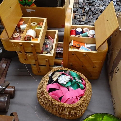 361 - A cantilever sewing box with various cotton reels, ribbons, and other sewing equipment