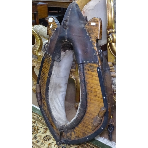 1404 - A 19th century pine and leather-mounted horse's halter, H86cm