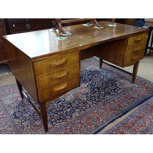 1407 - A Danish mid-century rosewood kneehole writing desk, fitted with 6 short drawers, with CITES certifi... 