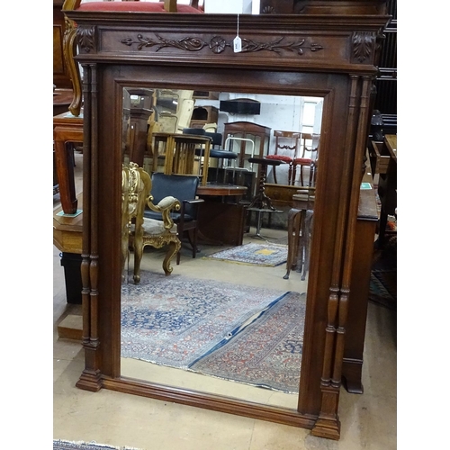 1412 - A French carved walnut-framed wall mirror, with fluted twin columns, height 5'8