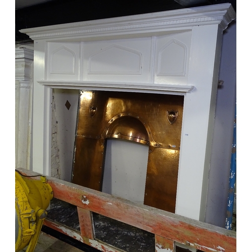 1453 - An Arts and Crafts painted pine fire surround, together with original studded copper insert, W145cm,... 