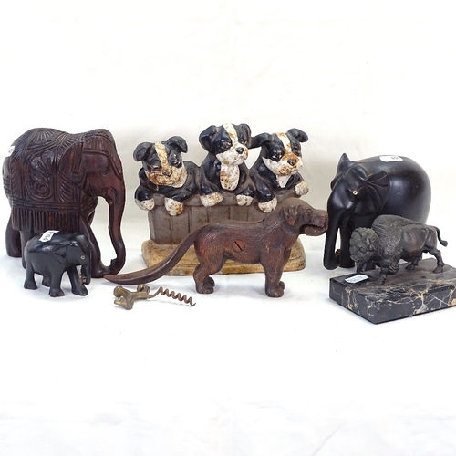 409 - Painted cast-iron puppy doorstop, small Bison sculpture, dog nutcracker etc