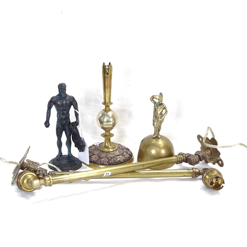 472 - Brass bell surmounted by a figure, 13cm, candlestick, warrior figure, and a pair of brass lamps