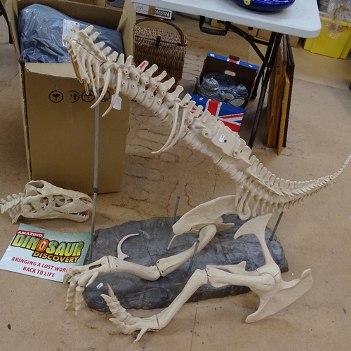 479 - A large plastic model of a Tyrannosaurus Rex dinosaur on plastic stand, for reassembly