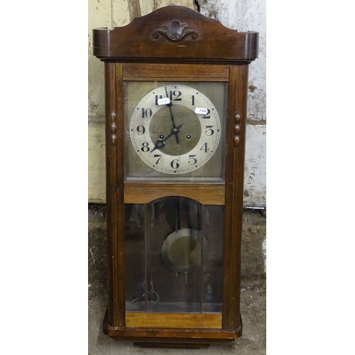 1466 - A 1920s walnut-cased hanging wall clock, with 2-train movement