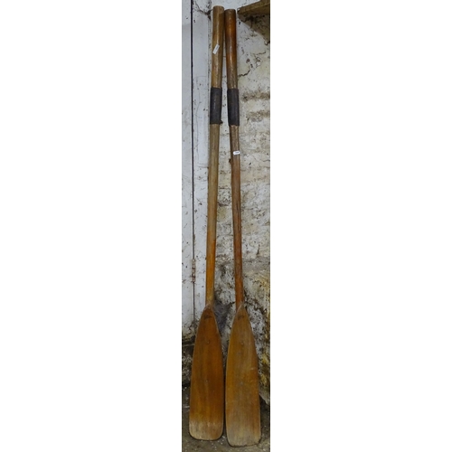 1467 - A pair of teak oars (ornamental use)