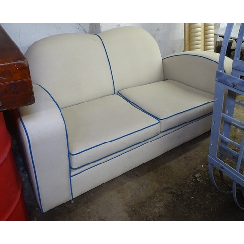 1481 - An Art Deco 2-seater settee of stylised form, recently reupholstered, L175cm