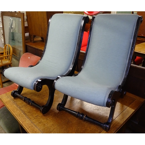 1486 - A pair of Victorian ebonised children's slipper chairs