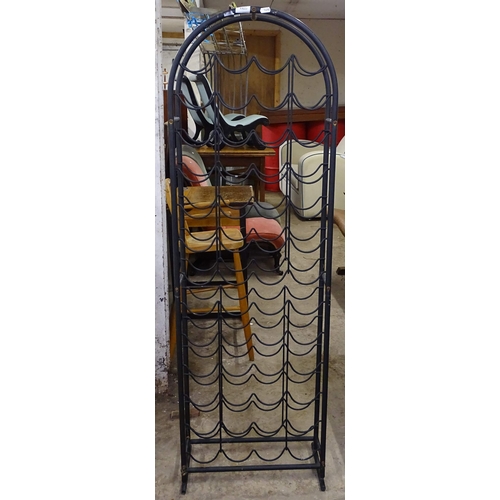 1490 - A modern black wrought-iron wine rack, H143cm