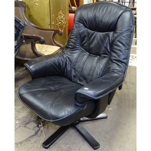 1491 - An upholstered swivel armchair on star base