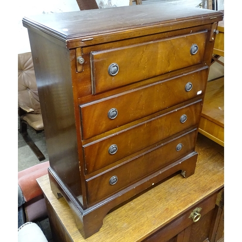 1495 - A reproduction mahogany bachelor's chest, with fold-out top and 4 graduated drawers under, on bracke... 