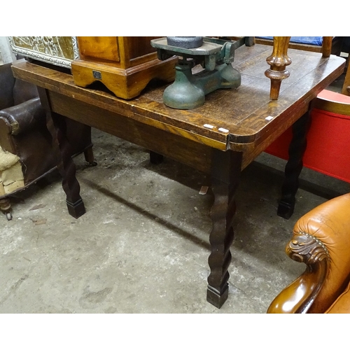 1511 - A 1920s oak and mahogany draw leaf table