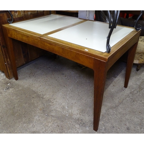 1514 - A Danish design teak extending dining table, with inset formica panels and butterfly extension leaf