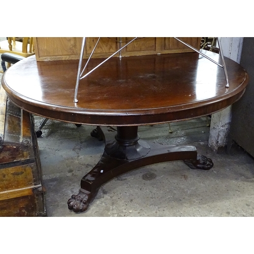 1530 - A William IV mahogany circular-top breakfast table, on turned centre column and trifor base, with ca... 