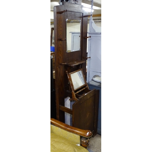 1554 - A 1930s oak hall stand, and a walnut swing toilet mirror