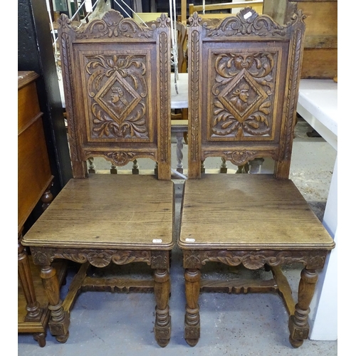 1558 - A pair of Bretton carved and panelled-back hall chairs