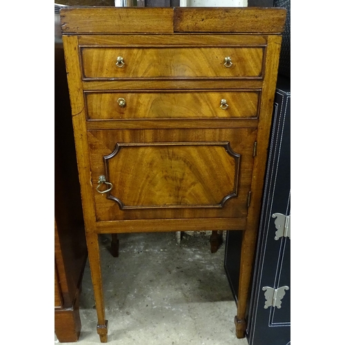 1570 - A George III mahogany gentleman's wash stand, with fold-out top, drawer and cupboard under, square t... 