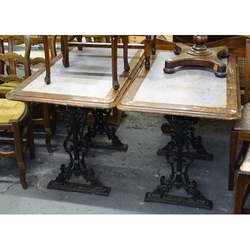 1576 - A pair of rectangular-top garden tables, on scrolled metal bases