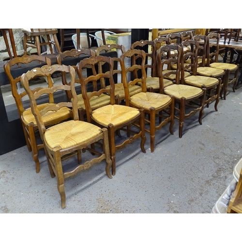 1578 - 14 French oak ladder-back and rush-seated dining chairs