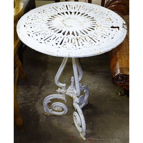 1587 - A painted cast-iron garden table, W56cm