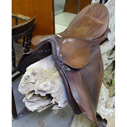 1604 - A leather saddle (ornamental use only)