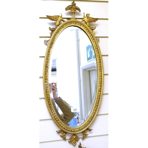 415 - A pair of gilt-gesso framed oval wall mirrors, overall height 72cm