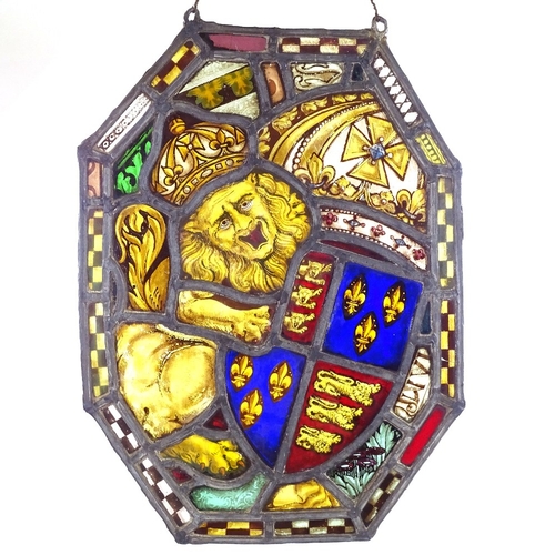 100 - A 19th century stained glass leadlight panel with heraldic lion design, 46cm x 34cm