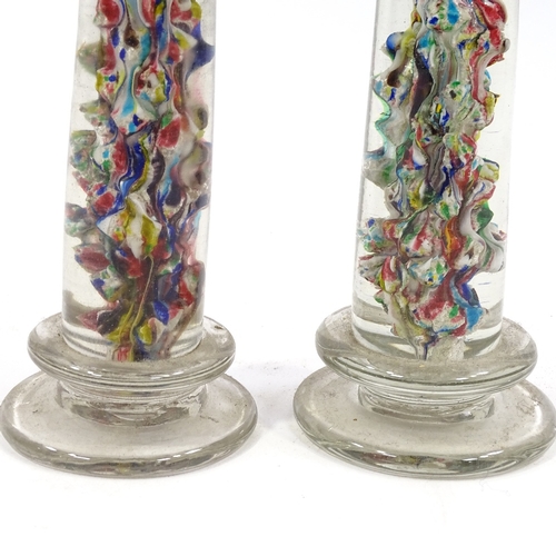 66 - A pair of Victorian glass columns with multi-colour internal glass decoration, height 30cm