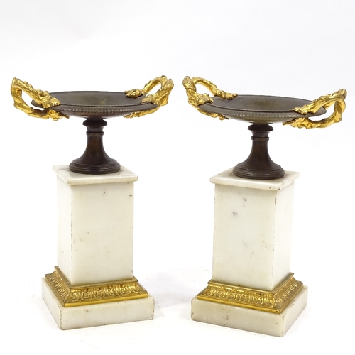 69 - A pair of 19th century parcel gilt-bronze 2-handled tazza on bronze-mounted white marble pedestals, ... 