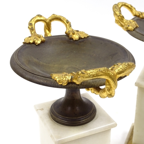 69 - A pair of 19th century parcel gilt-bronze 2-handled tazza on bronze-mounted white marble pedestals, ... 