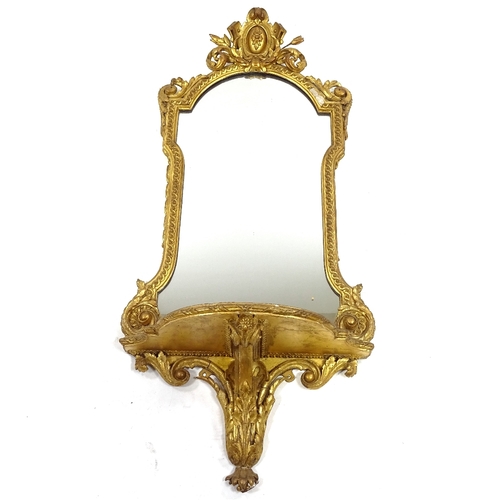 84 - A 19th century gilt-gesso framed wall mirror with shelf below, overall height 1.1m, shelf width 50cm