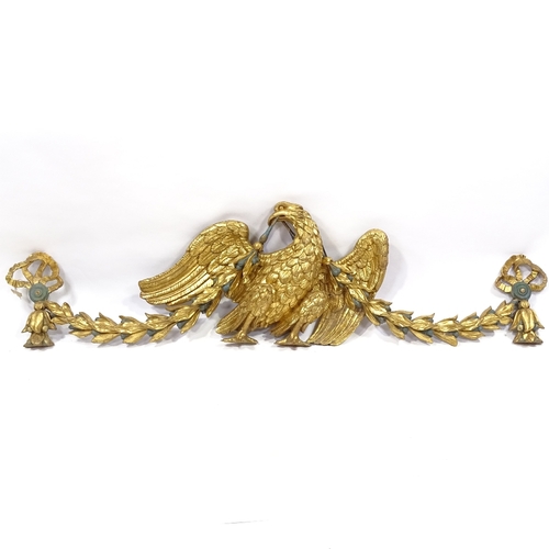 85 - A 19th century carved giltwood heraldic eagle design pediment with bell flower and ribbon swags, 1.6... 