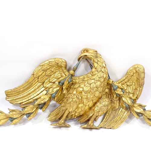 85 - A 19th century carved giltwood heraldic eagle design pediment with bell flower and ribbon swags, 1.6... 