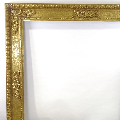 86 - A large 19th century relief carved giltwood mirror frame, 1.75m x 1.75m