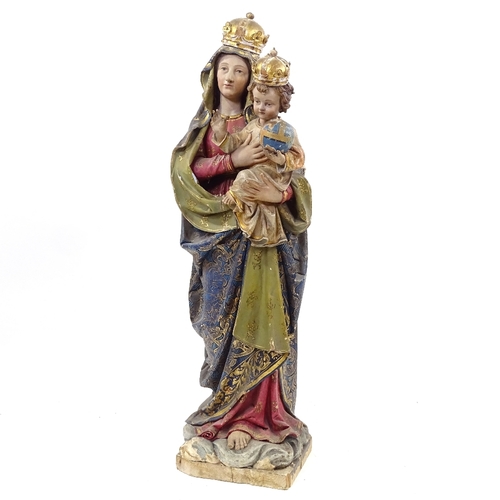 90 - A 19th century Italian carved painted and gilded wood and gesso figure of Mary and the infant Christ... 