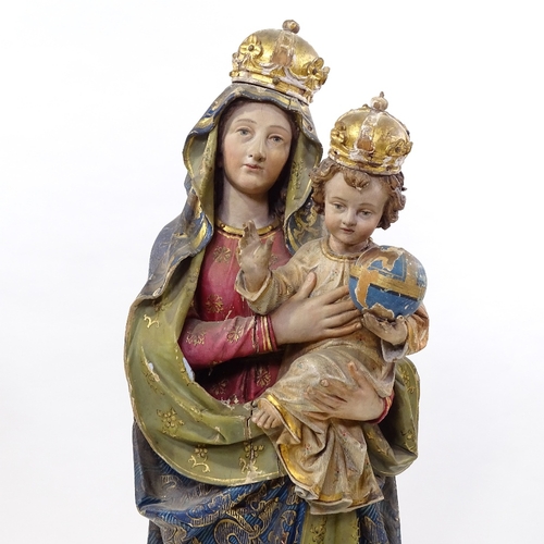 90 - A 19th century Italian carved painted and gilded wood and gesso figure of Mary and the infant Christ... 