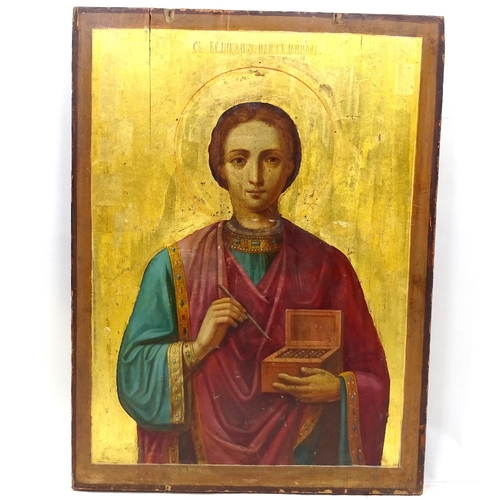 107 - A Russian painted and gilded wood icon, 18th or 19th century, depicting a saint with Cyrillic inscri... 