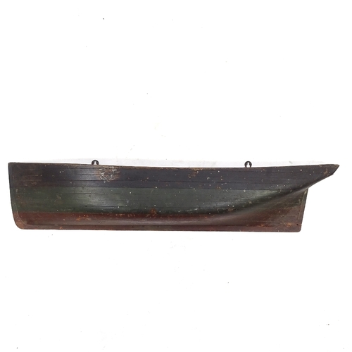 109 - A 19th century painted solid wood half boat hull, length 97cm