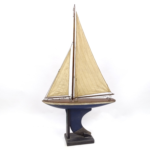 113 - A Victorian painted wood hulled model pond yacht, with sails and rigging, hull length 16cm, height 1... 