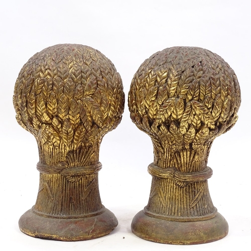 115 - A pair of Victorian carved giltwood wheatsheaf design finials, height 35cm, diameter 20cm