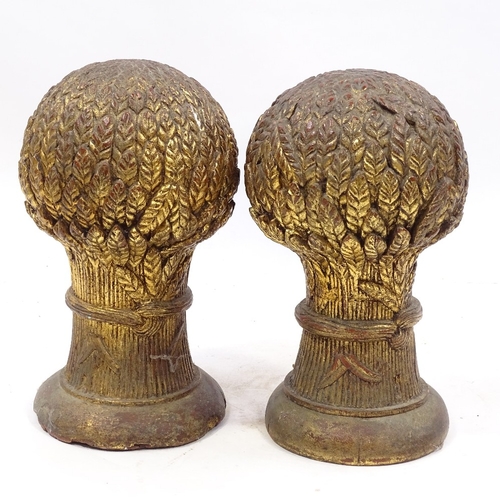 115 - A pair of Victorian carved giltwood wheatsheaf design finials, height 35cm, diameter 20cm