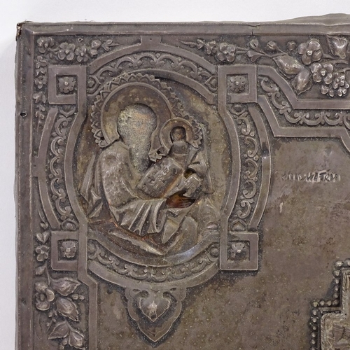 102 - A Russian silver-fronted icon, 18th or 19th century, relief moulded figures of the saints with Cyril... 