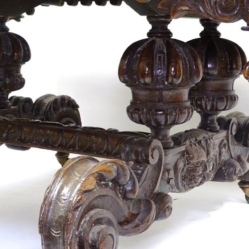 415 - A Victorian Carolean style oak library table, with end frieze drawers, raised on heavy carved scroll... 