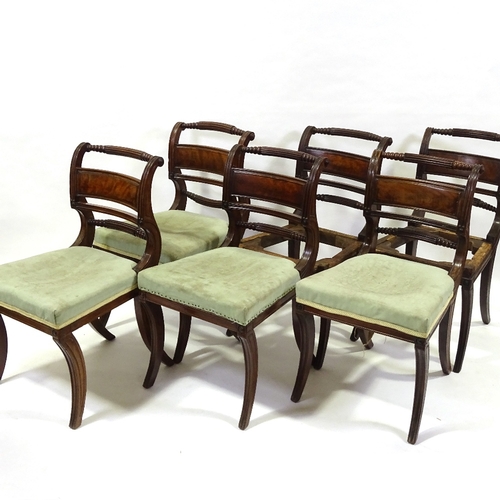 433 - A set of 6 George III Irish mahogany dining chairs, with carved and fluted back rails, and sabre leg... 